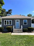 Total Remodeled Inside and Outside , New Kitchen with Quartz Counter Tops with Lifetime Warranty Transferable to New Owner, New Appliances, New Bathrooms, New Roof, New Doors Inside and OutsideNew Vinyl Fencing, In Ground Sprinklers, Note Basement Sold As Is , HOME SOLD AS IS CONDITION