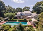 Welcome to 92 South Country Road, a remarkable residence where 18th century charm meets contemporary luxury in the serene hamlet of Remsenburg. This elegant and pristine home is perfectly situated on over an acre of bucolic gardens, and offers exquisite living experience encompassing 3176 square feet of beautifully updated space. The living room and dining room are open concept with a fireplace serving both rooms. A beautiful screened in porch is accessed from the dining room...perfect for cocktail hour! There is a chef&rsquo;s kitchen with marble topped island, fireplace and generous eating area adjoining a mud-room complete with storage and washer and dryer. There is a library/office with a cathedral ceiling and a primary bedroom with fireplace, primary bath, and walk-in closet. A back staircase completes the first floor.The second floor has 3 bedrooms and two full baths.A stunning backyard oasis featuring a sparkling resort-style pool, an elegant pool house, and beautifully designed outdoor kitchen situated on manicured landscaped grounds designed for both relaxation and entertaining. The perfect blend of luxury and tranquility, this outdoor retreat feels like a perfect getaway right at home.