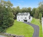Experience the perfect blend of luxury and craftsmanship at 271 Diddle Road in Poughkeepsie, NY! Sitting on 2.3 acres of land, this elegant, move-in-ready home was built from the ground up with high-end finishes, a thoughtful layout, and the luxurious details todayâ€™s buyers are looking for. From the moment you step inside, youâ€™ll be welcomed by a bright foyer with a coat closet, leading into a spacious, sunlit living room with large windows that flood the space with natural light. The open floor plan flows seamlessly into the dining area and into the heart of the home a show-stopping, designer kitchen thatâ€™s as functional as it is stunning. Featuring a massive center island with extra storage, custom-crafted cabinetry, luxurious quartz countertops, and sleek stainless-steel appliances, this kitchen was built to impress. A spacious walk-in pantry keeps everything organized and within reach, while double sliding doors lead out to a private back patio, making indoor-outdoor entertaining effortless. On the main level, a stylish half bath includes a bonus nook with extra counter space ideal as a coffee or serving station. Upstairs, enjoy a dedicated laundry room with a washer, dryer, sink, and cabinetry. The primary master suite features his and hers walk-in closets with custom shelving, and a spa-like en-suite with a glass-enclosed shower, soaking tub, double vanities, and elegant tile flooring. A second spacious suite offers its own private bathroom and double closets with built-in shelving, while an third suite also include a full bathroom with a walk-in shower and a large closet with custom shelving perfect for family members or visitors seeking privacy. A pull-down attic stairs with spray foam insulation for energy efficiency. The fully finished lower level adds versatile living space with a play area, a home office, utility room, and two access points to the garage, one featuring a custom-built mudroom area with hooks and shoe storage. Outside, a newly paved driveway leads to the attached two-car garage and a spacious leveled backyard surrounded by nature.. Enjoy shopping and dining at Poughkeepsie Galleria, Eastdale Village, and local favorites. Nearby youâ€™ll also find Vassar College, Dutchess Community College, parks, golf courses, hiking trails, and the Metro-North train station for a direct commute to New York City. As well as easy access to Route 55, Route 9, and the Taconic State Parkway.