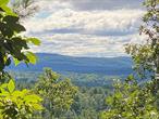 Now on the market: one of the most significant undeveloped land holdings in Ulster County. Spanning over 686 acres, this rare offering is set in the ideal location: right in the heart of the Rondout Valley and just 90 minutes from New York City. Perfectly positioned between Kingston, Accord, and Saugerties/Woodstock. Surrounded by protected state lands, the property offers breathtaking, panoramic views of the Catskills & Shawangunk Mountains, making it ideal for conservation or retreat development.The landscape is a stunning mix of forests, meadows, mossy ravines, and dramatic bluestone ridges, interwoven with miles of creeks and hiking trails. One of the property&rsquo;s most unique natural features is a waterfall that stretches over a mile, tumbling down scenic bluestone slopes.With four deeded access pointsâ€”on Dug Hill Road, Bluestone Ridge Road, Hurley Mountain Road, and Eagleâ€™s Nest Roadâ€”this land offers excellent flexibility. Zoning is agricultural, allowing for a wide array of potential uses, and the land currently benefits from a forestry program that reduces property taxes. This property is made up of four separate parcels, all combined to offer a rare opportunity of acreage. There are no easements in placeâ€”just open potential. Come create a private estate, eco-community, or investment property for land banking in one of the most sought-after corners of the Hudson Valley.