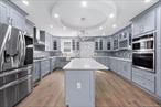 Looking for space? Look no further! Your search ends here!227-26 112th Road is a custom built massive single family that spans over 2880 sq/ft of living space. Sitting on a 60x100 lot on a beautiful tree lined street of the Queens Village/ Elmont border. Featuring a wide private driveway, garage, tons of yard space to enjoy outdoor gatherings. This massive single family is the perfect opportunity for large families. Open the door and enter an expansive sun drenched modern, open concept living/dining area which provides great space for entertaining. The jaw dropping custom kitchen is any chefs dream! Kitchen features floor to ceiling custom cabinetry, adorned with a full fleet of stainless steel appliances, island for bar stool seating, and leads out into lush rear yard. Powder room on 1st floor for your guest. Up a flight of stairs onto the second floor 3 massive bedrooms awaits you, each equipped with ample closet space. The elegant primary suite is equipped with a private en suite that boast spa-like finishes. Down the hall a fully tiled bathroom is adorned with state of the art wall and floor tiles and is shared between the additional bedrooms. The high ceiling full finished attic serves as a king sized bedroom. The high ceiling full finished basement has both interior and exterior access and can easily be used as the perfect media den, in-law unit, guest quarters, home office, storage space, or additional recreational space. Renovations include brand new select wide oak wood flooring, recessed lighting, brand new electrical, heating, plumbing, central HVAC systems throughout. This massive single family is conveniently located with close proximity to major transportation which makes commuting a breeze. Just off the Cross Island Parkway, Hempstead Turnpike, Dutch Broadway. Short blocks to UBS Arena, Elmont LIRR Station, schools, shopping centers, restaurants, cafes, parks and many other vibrant neighborhood amenities.