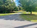 Two lots sold together totaling just under 1 acre. 1000 gallon concrete septic tank and leach fields already in place. Drilled well complete. Under ground 200 amp electric service installed. Current mobile home will be removed. Flat lot with all utilities in a well established residential area just waiting for a new home.