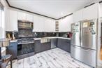 Fully Renovated Two-Family Home with Parking, Solar Panels & Modern Amenities! Welcome to this gut-renovated two-family home, perfectly situated on a quiet, tree-lined street just minutes from the 46th Street station (M & R subway lines)â€”offering a quick and convenient commute to Manhattan. Originally built in 1935, this property was completely redone in 2024 with no expense spared. Enjoy peace of mind with brand-new plumbing, electrical, windows, roof, boilers, and solar panelsâ€”this is essentially a brand-new home inside and out. Set on a 20â€™ x 100â€™ lot with a 20â€™ x 48â€™ building footprint, the home includes private parking and offers a smart layout with great income potential. The first-floor unit is a large 1-bedroom duplex featuring a fully finished basement complete with a wet bar and electric fireplace, creating the perfect space for entertaining or extended living. The second-floor unit is a spacious 2-bedroom apartment, also fully updated with a clean, modern aesthetic. Both units include: â€¢ Split heating & cooling systems for energy-efficient comfort â€¢ Stainless steel appliances: refrigerator, stove, microwave, and dishwasher â€¢ In-unit washer and dryer â€¢ Individual gas-powered boilers for independent hot water and heat â€¢ Electric hot water heater as a backup system Whether youâ€™re a homeowner looking for extra rental income or an investor seeking a turn-key property, this home offers exceptional value, flexibility, and long-term energy savings.