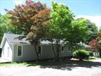 The next best thing to Lakefront! This sprawling ranch home is a stoneâ€™s throw from access to Whaley Lake, with lake rights to all the great amenities: private beach, motorboats allowed, kayaking, fishing, swimming, sunbathing, picnicking, fall leaf watching and winter ice fishing too! With 2 bedrooms plus an Office, Den, Living Room and Family Room â€“ thereâ€™s so much potential including one floor living and definite Mother/Daughter possibilities. Updates have been started, the interior painted and you have peek-a-boo views of the lake through numerous windows. Spacious, open Living Room and Dining Area with new luxury vinyl plank floors, high ceilings, lots of light and French doors to a wraparound deck for outdoor relaxing and entertaining. 2 functioning kitchens: #1 is galley style with a breakfast bar, stainless steel appliances and a pantry closet for extra storage. #2 is traditional style with tile floor, exterior access door and a full compliment of appliances â€“ stove, refrigerator, dishwasher and microwave all included. The Office has privacy from the rest of the house. 2 additional full Bathrooms plus conveniently located laundry closet with full size washer and dryer. Primary Bedroom with double closets and ensuite bathroom with new tile floors, walk in shower and double closets. Second bedroom, Den for library or play space and Family Room with antique fireplace giving this room warmth and character. Basement includes utilities and lots of storage for kayaks and other lake necessities. You need to tour to really appreciate the potential â€“ schedule a showing today.