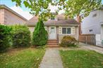 Flushing 3BR/2BA home on a 40 x 100 lot in a private setting, walking distance to Kissena Park. Features a mother/daughter style setup and 2-car garage. Needs updating, but a fantastic opportunity to renovate, extend, or rebuild. Prime location near shops, schools, and transportation