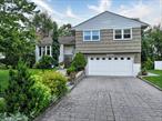 This beautifully updated home is move-in ready, blending modern elegance with classic charm. Sun-filled interiors are complemented by an inviting outdoor retreat. The dramatic living room boasts vaulted ceilings, oversized windows, a cozy fireplace, and gleaming hardwood floors, flowing effortlessly into the dining room â€” perfect for gatherings. The renovated eat-in kitchen features quartz countertops and high-end appliances.Upstairs, the primary bedroom features an ensuite bath, a walk-in closet, while two additional bedrooms share a hall bathroom. The lower level offers a bright family room that opens directly to the new paver patio and backyard, plus bonus basement space ideal for a home office, playroom, gym, or storage.Outside, the expansive yard framed by a custom stone wall, is enhanced by a newly added walkway connecting the front and back of the home â€” a one-of-a-kind setting for relaxation or entertaining. Additional highlights include a two-car attached garage.Perfectly located in a coveted neighborhood near Davis Elementary School, shopping, dining, and transportation, with nearby bus service to the Scarsdale Metro-North Station for a quick ride into New York City. Donâ€™t miss your chance to make this property yours.