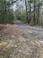 Build your dream home on this partially wooded 5 acre lot on a quiet road. This parcel of land had been engineered and approved for a 4 bedroom single family home. But could be modified to build a attached side-by-side 2 family or attached mother/daughter house as well. Beautiful lot with a stream runs across. Part of the driveway has been built. Previously approved site plan is available. Adjacent Lot is available for sale as well.
