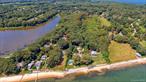 East Marion, North Fork: Discover a remarkable opportunity with this generous 0.964-acre (42, 000 square feet) building lot nestled in the charming community of East Marion. Ideally situated just moments from stunning local beaches and picturesque parks, this lot is also mere minutes away from the vibrant shopping and dining scene of Greenport. Imagine crafting your dream home in this idyllic setting, where you can enjoy potential bay views that will take your breath away. A detailed survey is readily available, giving you a clear vision of the possibilities. This lot is located in an R40/1 acre zone, making it perfectly suited for a single-family home or as an investment.