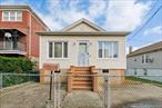 Welcome to this charming 3 Bedroom, 2 Bath single-family ranch in the sought-after Pelham Bay neighborhood of the Bronx. The home offers wonderful indoor and outdoor living with a welcoming front patio, a large deck overlooking the backyard and 9-foot ceilings with custom moldings on the main level. The lower level includes a laundry room and a separate entrance, providing excellent potential for a recreation space, summer kitchen, guest suite with a full bath. Recent upgrades include a new hot water heater, furnace and roof. Conveniently located just 4 minutes from the 6 train (Middletown Rd station), bus lines, major highways, shopping, restaurants and schools. A one-car detached garage.