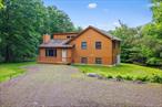 Step into your own Catskills sanctuary. This charming 3 bedroom, 2 bath home rests on 6.5 acres of lush, landscaped grounds, surrounded by tall trees and blooming greenery. Itâ€™s the kind of place where you instantly feel at ease, whether youâ€™re curled up by the fireplace, enjoying the glow of hardwood floors, or spending quiet afternoons on the 600 sq ft pool-ready deck overlooking natureâ€™s beauty. Thoughtfully updated with modern conveniences and many smart home features, the home includes an EcoFlow Battery Backup system which will automatically continue to provide power in the event of a power failure, and the system can be viewed and managed remotely via an app. This battery back up system can be expanded and is solar ready for the addition of solar panels to reduce grid dependency. The house is wired for both Spectrum and Frontier internet providing both WiFi as well as a fully hard wired voice/data network. Two separate app based camera systems each with local storage and remote viewing via the apps are set up for property monitoring & security . Wi-Fi programmable thermostats let you view and adjust the room temperatures remotely. There is a central stereo system, generous exterior lighting and power plus many recent upgrades add comfort, efficiency, security and peace of mind. The house is in move in condition and features a new roof with a 50 year warranty and recently painted exterior. The property offers space to breathe and grow, with a large basement/workshop for projects or storage and endless outdoor room for relaxation and play. Mornings begin with coffee outdoors, the cool mountain air and sound of songbirds surrounding you. Spend the day kayaking the Delaware River, hiking nearby State land, or exploring local shops and restaurants. Take in world-class performances at the Bethel Woods Center for the Arts or enjoy a peaceful afternoon at the Kadampa Meditation Center. In the winter, itâ€™s just as magicalâ€”a quick trip to the slopes for skiing, then back home to warm up by the crackling fireplace. All of this, just two hours from NYC, and moments from everything you love about the Catskills. This isnâ€™t just a houseâ€”itâ€™s a place to slow down, recharge, and create memories with the people you love most.