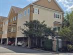 MAPLE SQUARE TRIPLEX TOWNHOUSE. End unit. 1 car garage with carport, enough room for 2 cars. Private, yet centrally located. Walk to 2 blocks to restaurants, shopping and LIRR.END Unit with extra windows. Open concept floor plan await you on the first floor with a Living Room and Designer Kitchen with stainless steel appliances and granite counters for the discerning homeowner.The Second Floor features a large bedroom with soaring cathedral ceiling and walk-in closet. Full Bath awaits with bath, elegant tile and flooring . The top floor loft, many uses, Exercise Room/Office/Storage along with stackable laundry Closet.  Utility Closet