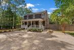 Tucked away on a quiet corner lot of just over 0.63 acres, this three-bedroom, two-bath Saltbox blends Hamptons charm with modern upgrades and sustainable living. Inside, the sun-drenched living room showcases a dramatic floor-to-ceiling brick fireplace and glass sliders leading to an expansive new 3, 000&#177; sq. ft. mahogany deck-perfect for entertaining or quiet relaxation. The home has been thoughtfully updated with a brand-new solar system, a high-efficiency heat pump, a new HVAC system, and a universal EV charger to minimize energy costs and environmental impact. Additional enhancements include a whole-house dehumidifier, water filtration system, irrigation system, and a high-speed car charger. The outdoor setting is a private oasis. A custom bluestone Gunite pool and spa (by Rachel Lynch), surrounded by extensive hardscaping and lush new landscaping, creates a resort-like atmosphere. Enjoy the fire pit, stream music through the indoor-outdoor Sonos system, or unwind in the fully fenced backyard. Just 3 miles from East Hampton Village, the property offers easy access to bay beaches, Springs Dog Park, local restaurants, nightlife, and various water activities, including kayaking, paddleboarding, and boating. Turnkey, stylish, and eco-smart, this Springs retreat is ready for summer living.