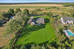 Set against the backdrop of the stunning North Fork, this brand-new luxury home in Cutchogue offers the perfect mix of sophisticated design and laid-back coastal living. Just minutes from renowned wineries, farm-to-table restaurants, and some of Long Islandâ€™s most beautiful beaches, this 5-bedroom, 4-bathroom gem invites you to enjoy the best of both worlds.The heart of the home is the expansive great room, where large windows flood the space with natural light, creating a warm and inviting atmosphere. This open layout flows seamlessly into a spacious dining area and a chefâ€™s kitchenâ€”a true focal point of the home. With a large center island, custom cabinetry, and quartz countertops, itâ€™s a perfect place for both everyday meals and entertaining guests.The first-floor primary suite offers a serene retreat, with a spa-inspired bathroom that includes a soaking tub and a rain shower, as well as ample closet space for ultimate convenience. The thoughtful design and attention to detail are evident throughout, from the elegant oak hardwood floors to the custom tile work in the bathrooms.Outside, the home is beautifully surrounded by lush, manicured landscaping, offering the ideal setting for outdoor entertaining or simply relaxing on the front or back porch. Whether youâ€™re enjoying the local wine country or unwinding in your private sanctuary, this home provides the perfect space to do it all.With its perfect blend of luxury, location, and lifestyle, this Cutchogue beauty is ready to welcome its new owner. Donâ€™t miss the chance to experience a new level of comfort and sophistication on the North Fork.Whether you&rsquo;re hosting guests or seeking a peaceful escape, this home delivers timeless design, high-end craftsmanship, and unbeatable access to all that makes the North Fork a premier destination.