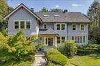 Discover the pinnacle of Pelham Heights living at 120 Cliff Avenue, where stately Colonial architecture meets modern luxury in a coveted walk-to-all location. Set on a prime block just steps from the Metro-North train, this exceptional home offers a seamless 30-minute commute to Grand Central and a lifestyle defined by elegance and ease. A gracious center-hall foyer opens to expansive main-level living designed for both entertaining and everyday comfort. The formal living room, with custom built-ins and a wood-burning fireplace, flows into a sun-filled family room featuring a striking stone fireplace and access to a screened-in porch â€” a year-round retreat for morning coffee or evening gatherings. Walls of windows illuminate the formal dining room, also with its own fireplace, while the chefâ€™s kitchen is a true centerpiece with Sub-Zero refrigerator, Wolf cooktop, double ovens, dual dishwashers, granite island with seating, and a bright breakfast area. A thoughtfully designed mudroom with built-in storage and back entry connects seamlessly to the garage, parking, and fenced backyard. A stylish powder room completes this level. Upstairs, the serene primary suite features a marble spa bath with steam shower, soaking tub, double vanity, and custom dressing room with walk-in closet. Three additional bedrooms (two with en-suite baths) and a hall bath complete the second floor. The third floor offers two more bedrooms and two full baths (one en-suite), plus two versatile bonus rooms ideal for home offices, and two walk-in closets for off-season storage. The finished lower level includes a recreation room and a show-stopping, temperature-controlled wine cellar for the discerning collector. Outside, a blue stone patio and private backyard offer the perfect setting for al fresco dining, entertaining, and play, while the detached two-car garage provides added convenience and storage. This is a rare opportunity to enjoy the very best of Pelham â€” just moments from award-winning schools, village shops, restaurants, and train.