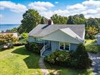 Beautiful ranch with incrediable water views only a short distance to the beach. Large spacious rooms with hardwood floors through out The living room has a wood burning stove and a bow window The ajoining dining room has panoramic waterviews of the Long Island sound. The eat in kitchen has plenty of wood cabinets pantry and spacious dining area..There are 3 bedrooms with spacious closets. The basement is full with an outside entrance and bilco doors too. The property is level with a large deck and 1 car garage. The future buyer will be able to join the North shore Beach Association.