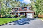 Welcome to this stunning colonial home, perfectly situated in a tranquil and inviting cul-de-sac, surrounded by a picturesque, park-like setting that enhances the beauty of the neighborhood. Upon entering the residence, you are warmly greeted by a bright and airy foyer that showcases exquisite wood floors flowing seamlessly throughout the entire lower level. This welcoming space thoughtfully includes a formal dining room that is perfect for hosting dinner parties and family gatherings, along with a spacious and comfortably designed living room. These areas lead effortlessly into a large den, which serves as an excellent space for relaxation and entertainment. Adjacent to the den is a charming country-style kitchen, which is fully equipped with modern granite countertops and high-quality stainless steel appliances, making it a joy for any home chef.From the kitchen, elegant Anderson glass sliding doors provide a seamless transition to a vast and tranquil backyard, a perfect oasis for family gatherings, outdoor activities, barbecuing, or the potential addition of a future swimming pool. The cozy wood fireplace enhances the warmth and comfort of the lower level, making it an inviting space for relaxation and family time throughout the year. Additionally, a convenient half bath and direct garage access enhance the main floor&rsquo;s functionality, ensuring that daily living is made effortless.As you ascend to the second floor, you&rsquo;ll discover four generously sized bedrooms, each basking in natural light, providing a peaceful retreat for everyone in the family. Notably, the main bedroom features its own en-suite bath and ample closet space, ensuring comfort and privacy. The home has been meticulously freshly painted, exuding a sense of newness and vibrancy, and boasts beautifully updated flooring that is both stylish and durable throughout.Conveniently located near a variety of shopping centers, schools, and accessible transportation options, this home offers an ideal blend of comfort and accessibility that is hard to beat. Do not miss your chance to own this little slice of heavenâ€”your dream home awaits!
