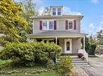 Welcome to 23 Willow Avenue â€“ A Classic Colonial in the Heart of Cornwall.This charming three-bedroom, two-bath Colonial blends timeless character with thoughtful updates, just steps from Cornwallâ€™s Main Street shops and restaurants. Be greeted by the welcoming mahogany front porch, and brick-lined path, framed by a Japanese Maple and a sweet garden with Black-eyed Susans, day lilies and lavender. Enter through the foyer featuring an original staircase, a beautifully patterned radiator, and a striking stained-glass window. The living room showcases wide-plank hardwood floors and a pocket door leading to the sun-filled formal dining room with a bay window, mantel, and a free-standing gas stoveâ€”perfect for cozy nights. The kitchen has been tastefully updated with granite counters, subway tile backsplash, stainless steel appliances, new gas range, glass door cabinets, and a small island with storage. From here, step out to the new Trex deck for al fresco dining, overlooking a lush perennial garden filled with weeping cherry, bee balm, lilacs, Rose of Sharon, a frog pond, and a birdbathâ€”an outdoor oasis on nearly a quarter acre of landscaped grounds. An outbuilding workshop and shed make it a gardenerâ€™s delight. The first-floor bathroom is conveniently located and features wainscoting, pedestal sink, subway-tiled shower surround, and penny tile shower base. Upstairs, the primary bedroom is surrounded by windows and natural light. The charming full bath boasts a soaking tub, antique wood vanity, mosaic tile flooring, and a tin ceiling detail. Two additional sun-filled bedrooms complete the second floor. The walk-up attic provides ample storage or the opportunity to create a studio or bonus space. This home boasts a new roof, windows and screens, and whole house generator. Prime location close to Storm King Art Center, Jones Farm, Black Rock Forest hiking. This home offers the perfect blend of classic character, modern upgrades, and a walkable locationâ€”a true Cornwall gem!