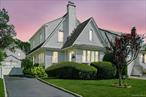 Welcome to this enchanting Colonial home in the sought after Highlands neighborhood of White Plains. With its classic peaked roofs and storybook curb appeal, this home invites you into a timeless yet modern living experience. Surrounded by blooming hydrangeas, the exterior feels like a fairytale. Step into the spacious, heated foyer, lined with windows and bathed in natural light, featuring beautiful light oak hardwood floors, making it the perfect spot to relax with your favorite book. Through a French door, you&rsquo;ll find a cheerful and inviting living room, centered around a wood-burning fireplace and framed with classic ceiling moldings. The formal dining room exudes modern elegance, highlighted by a stunning chandelier featuring multiple hanging orb lights, setting the perfect mood for entertaining. The thoughtfully designed kitchen features granite countertops, stainless steel appliances, a wall oven, and a dedicated space for a workstation or coffee bar, plus a cozy breakfast nook. From here, step out to your dreamy, private, fenced-in backyard, complete with a stone patio, gazebo, and space for outdoor dining and entertaining. Upstairs, the primary bedroom is complemented by two additional bedrooms and a full hall bathroom featuring a marble vanity. Directly behind the bathroom, you&rsquo;ll find an expansive walk-in closet, an unexpected bonus offering abundant storage or potential for a luxurious dressing area. The finished lower level adds even more versatility with a generous recreation room, ideal for movie nights or playtime, along with a dedicated laundry room to keep life tidy and efficient. Located just a short walk from schools, shopping, and dining, and minutes from major highways and Metro-North, this home is perfect for anyone seeking a true turn-key forever home.