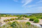 Incredible Views of Mount Sinai Harbor! Discover this exquisite 3/4-bedroom Townhome nestled within the coveted Riviera Private Community. Revel in the opulent living, boasting an airy open floor plan. The gourmet Eat-In Kitchen features Gorgeous Custom cabinets, granite countertops, and High End Appliances. The Living Room boasts a propane fireplace, while the Formal Dining Room offers oversized sliders leading to a private deck. Enjoy stunning year round water views from the Living Room and Dining Room on the first floor and Even more captivating water views from the second floor primary Bedroom and 2nd Bedroom. The Primary Suite offers breathtaking water views of Mt. Sinai Harbor & LI Sound, an extravagant state-of-the-art Primary Bath, and a spacious walk-in closet. There is 2 additional bedrooms and a newly redone full bath on the second floor. Throughout the first floor you&rsquo;ll find hi-hat and hardwood flooring, this home also offers a 1st Floor Bedroom/office/Den and a first floor Laundry. The community boasts a heated saltwater IGP, with HOA amenities including snow removal & trash collection. Indulge in all the Port Jefferson Village amenities!