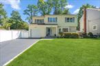 Welcome! To A Move In Ready Colonial, Updated 2024 Front Features Stunning Bluestone Pavers. Located In The Heart Of WEST HILLS Section Of Huntington. Light And Bright Entrance Foyer,  Leading To Open Concept Living Room and dining, All Updated Matte Hardwood Floors Through Out Home, The Kitchen Features Bright, Soft-White Cabinetry With Granite Counter Tops, Center Island With Seating, Wine Cooler, And Stainless Appliances. Leading Out Sliders To New Patio With Pavers Updated 2024. Second Level, Primary Bedroom With Tray Ceilings, Two Walk In Closets & Beautiful Full Bath. 3 Additional Oversized Bedrooms With Additional Full Bathroom On Second Bath, .CAC, 200 Amp Electric, 2 Zone Heating , Inground Sprinklers.