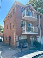 This well-maintained, versatile legal 3-family building features a fully operational office space on the first floor with a private entrance, half bath, and direct access to both the backyard and a full-sized basement-ideal for expanded office use, storage, or support functions. Above, two spacious residential units each offer 2 bedrooms, 2 full bathrooms, functional layouts, front and back balconies, and excellent rental income potential. Perfect for investors, owner-occupants, or professionals seeking to grow their practice, this turn-key property provides flexibility, functionality, and long-term value. Additional features include a private driveway and one-car garage. 3 gas 3 boilers and 4 electric meters. Conveniently located less than a mile from the Main Street 7 train and LIRR, and just six blocks from supermarkets, restaurants, and the heart of Downtown Flushing, this high-visibility property enjoys steady foot traffic and excellent transit access.