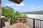 Welcome To Your Private Lakefront Retreat, Where Traditional Craftsmanship Meets Modern Luxury! Perched Above Sparkling Waters With Panoramic Mountain Views, This Home Was Designed To Celebrate Every Season On The Lake! From The Moment You Arrive, The Curb Appeal Stands Out With Timeless Cedar Siding And A Handsome Cultured Stone Facade On The Covered Porch Entry, A Warm Welcome That Hints At The Charm You Will Find Within. Step Inside And Be Immediately Drawn To The Grand Arched Picture Window Framing The Lake Like A Living Work Of Art. Walls Of Windows Flood The Open Concept Layout With Natural Light, Seamlessly Blending Indoor And Outdoor Living. The Kitchen Is The Heart Of The Home, With Granite Countertops, Commercial-Grade SS Appliances, A Center Island With Breakfast Bar & Auxiliary/Prep Sink, And Abundant Cabinetry. Reclaimed Barn Wood From Nearby Sugar Loaf, NY Enriches The Design, Seen In The Exposed Beams, Fireplace Mantle, Built-In Desk & Bookshelves, Primary Bedroom Headboard/Doors And Even The Custom Dining Table. Anchoring The Dining Area Is A Dramatic Slate Ledge Stone Faced Floor-To-Ceiling Wood Burning Fireplace, Creating The Perfect Backdrop For Entertaining. The Living Room Invites You To Relax And Take In Endless Water Views, Or Step Outside Onto Multi-Tiered Decks That Cascade Down Toward The Shoreline. Here, Youâ€™ll Discover A Gazebo With Firepit And Ceiling Fan, As Well As Your Own Private Boat Dock! For Summer Fun Or Quiet Mornings With Coffee! Upstairs, The Loft With Built-In Desk And Bookshelves Overlooks The Dining Room Below. The Primary Suite Feels Like A Private Sanctuary, With Vaulted Ceiling, A Reclaimed Barn Wood Sliding Headboard/Doors, A Spa-Inspired Bath With Radiant Heated Floors, Double Steam Shower With Quartz Bench Seating, And Your Own Private Balcony. A Second Vaulted Bedroom With Balcony Offers Guests Their Own Slice Of Paradise. Additional Features Include Brazilian Red Cherry Hardwood Floors Throughout, Central Air, Hydro-Air Heating, Radiant Heated Baths, Whole-House Surround Sound (Wifi-Enabled Indoors And Out), A Security System, And An Oversized 2-Car Garage With Workshop, Loft & Crawl Space Storage, And Paver Driveway With Room For 7+ Cars. Set On A Quiet Dead-End Street, This Home Offers Unmatched Views Of Brilliant Sunsets And Ever-Changing Fall Colors Reflected Over The Water. Whether Youâ€™re Seeking A Full-Time Residence Or A Weekend Getaway, This Rare Property Delivers An Extraordinary Lake Lifestyle In Every Detail.