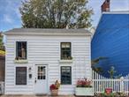 This 1860s Cold Spring Village cottage is brimming with heart. Steps from the riverfront, Main Street, schools, and Metro North, this home makes village living effortless. Step inside to a sunlit living space where every detail tells a story - exposed ceilings with knotty pine beams, reclaimed hardwood floors, charming shiplap pine walls and a warmth you can feel the moment you walk through the door. Smart design makes brilliant use of every inch of every inch of this cozy home. An open floor plan flows easily from the living and dining space to the kitchen, featuring convenient half bath, custom concrete counters and farm sink. On the second floor, the primary bedroom glows with sunlight behind French doors. An additional bedroom with open loft and cleverly situated full bath with claw-foot tub/shower & country sink complete this smart and seamless layout. Back porch and fenced, private back yard with reclaimed brick patio offers a low maintenance space to enjoy the outdoors. With it&rsquo;s blend of historic charm, walkable Village convenience and thoughtful design, this home is a rare opportunity - ideal for planting roots in Cold Spring Village or an easy low-maintenance weekend retreat just steps from the train
