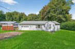 Welcome to this well-kept 2-bedroom, 1-bath ranch nestled on a full acre in the Town of Wawarsing. Built in 1960 and offering 928 sq ft of living space, this cozy single-level home is perfect for first-time buyers, downsizers, or anyone seeking a manageable home in a peaceful setting. The layout of this home features 4 total rooms, including a spacious kitchen, comfortable living areas, and an enclosed porch ideal for year-round enjoyment. The full bathroom is thoughtfully designed with a large walk-in shower for easy access, adding comfort and convenience.Located just minutes from the Village of Ellenville, local shops, dining, and the scenic Shawangunk Ridge, this home combines the charm of country living with close proximity to everyday conveniences.