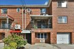 Welcome to this legal two-family attached townhouse-style home located in the heart of Kew Garden Hills. The first-floor unit offers a spacious one-bedroom layout with a dining room, living room, full kitchen, full bath, and a walk-in closet, along with its own private entrance for added convenience. The second unit is a duplex spanning the second and third floors. The second floor features a large living room with access to a private balcony overlooking the neighborhood, a formal dining room, a generously sized kitchen with a center island and open layout, and a half bath. Upstairs on the third floor, you will find three comfortable bedrooms and a full bathroom. In addition, the home includes a full finished basement with a separate exit to the private backyard, a full bathroom, generous closet space, and ample storage. Beautiful hardwood floors run throughout, and the backyard offers privacy for relaxation and entertaining. This property presents an excellent investment opportunity, offering strong income potential as well as the flexibility for multigenerational living, all within close proximity to houses of worship, schools, shopping, and transportation.