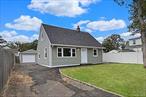 Home has been completely renovated. New bath, kitchen, floors, electrical, updated heating and windows. Warranties will convey. The back yard is level fenced and adjacent to an over sized one car garage. Ideal for storage, play space ... even a man cave. Adorable and move in ready
