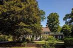 When beauty, history, tradition, and ease intersect in one lovely home, itâ€™s 425 Camby Road. Located minutes to the Village of Millbrook on 20 private acres including two barns, two ponds, manicured and landscaped lawns, sweeping meadows, and walking paths. Classic New England charm dates back to the mid-1800s with 21st century updates, this center hall colonial conveys the warmth of generations in its wide pine floorboards, numerous windows inviting in light and air, and the comfort of spacious rooms. The center hall opens on one side to a library and on the other side a formal dining room. The libraryâ€™s focal point is a stunning handcarved fireplace mantle. Off of the library is the living room. This modern addition aligns seamlessly with the historic home with built-in cabinets, large windows on three sides, and a glass paneled door leading to a fieldstone patio, perfect for outdoor entertaining and play.The dining room, which still retains many of the historic elements of the home, looks out over the front lawn and has a long window seat on one end. Directly off of the dining room is the eat-in kitchen which was part of a significant addition to the home. The kitchen contains a central island, a cooktop that would make any home chef happy, granite countertops, and plenty of cabinet space. The main level of the home also features a guest bedroom with full bathroom and also a mudroom with storage adding convenience and access to the yard. The basement has a full laundry and half bath. Upstairs, there is a large landing area ideal for a reading nook or workspace. There are three bedrooms with two full bathrooms, one with a large walk-in closet and laundry. There are two additional walk-in hall closets. The primary bedroom features charming eyebrow windows, a fireplace, and a private balcony. Outside, two koi-stocked ponds, a small stream, and beautifully landscaped lawns and gardens round out the property as a coveted location for country living. The meadow across the road provides a lovely view. Two picturesque barns, one of which serves as a garage, are outbuildings that could also be used as guest quarters, studios, or entertainment space. This property is a lovely combination of Colonial history and country living with a touch of New York sophistication. 24 Hours Notice Please for Accompanied Showings.