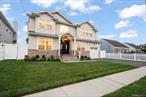 Take A Look At This â€œBetter Than Newâ€ Stunning 5 Bedroom/3 Bathroom Colonial Built In 2023 By A Highly Respected Local Builder! This Stunning Home Features An Airy Open Concept Layout, 9 Foot Ceilings On The First Floor, Hardwood Flooring Throughout, Grand Two Story Entry Way With Wainscoting/Millwork & Coat Closet, Formal Living, Formal Dining Room With Tray Ceiling & Wainscoting, Eat-In Kitchen With Quartz Countertops, Large Island, Stainless Steel Appliances, Gas Cooking, Under Cabinet Lighting And Adjacent Eating Area, Family Room With Fireplace & Custom Built-Ins, Ground Level 5th Bedroom And A Full Bathroom On The Main Level Complete The First Floor. The Second Floor Features Four Large Bedrooms Including Your Oversized Primary Bedroom With Tray Ceiling, Two Closets With Custom Built-Ins, En-Suite Bathroom With Dual Sink Vanity, Shower, Tub & Dedicated Linen Closet, All Other Bedrooms & Hallway Closets Have Custom Closets As Well, Laundry With Custom Cabinetry, Additional Full Bathroom In The Hallway With Dual Sink Vanity. Lastly, This Home Features An Expansive Full Basement With An Open Layout And Outside Entrance! This Home Additionally Features Vinyl Siding With Stunning Stone Work, Blacktop Driveway With Paver Surround & Paver Walkway, In-Ground Sprinklers, Natural Gas Cooking & Heating, Central AC And More! Purchasers Are Solely Responsible For Confirming All Listing Information.