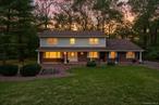 Perfect for extended family. Imagine stepping into a home where every detail feels like it was crafted just for you. Welcome to 19 Stonehedge Drive, a stunning 5-bedrooms, 3.5-bathrooms haven on .95 of an acre, nestled in one of West Nyackâ€™s most coveted neighborhoodsâ€”a place where charm meets modern elegance, ready to become the backdrop for your familyâ€™s next chapter.As you cross the threshold, the gleam of travertine floors welcomes you into an open-concept main level thatâ€™s as functional as it is beautiful. The heart of the home is a gourmet kitchen, where a sprawling granite island, illuminated by stylish pendant lights, invites gatherings with friends and family. Equipped with a Sub-Zero refrigerator, Thermador stove, and sleek stainless steel appliances, this space is a chefâ€™s dream, complete with a marble backsplash and recessed lighting that adds a touch of sophistication. The kitchen flows seamlessly into expansive living and dining areas, perfect for hosting lively holiday feasts or intimate dinners, with wainscoting and crown molding lending timeless appeal. The adjacent family room, warmed by an gas fireplace, offers a cozy retreat for movie nights, while the sun-drenched sunroom steals the show with its gas wood-burning stove and ductless ACâ€”ideal for sipping morning coffee or unwinding with a book. Step through the sunroomâ€™s doors to a spacious deck shaded by an awning, where summer barbecues and starlit evenings await. Outside, the meticulously landscaped front yard, kept lush by a sprinkler system, adds curb appeal thatâ€™s sure to impress.Upstairs, the primary suite is a sanctuary of comfort, boasting two walk-in closets and a private full bathroom for ultimate relaxation. Three additional bedrooms, each bright and inviting, share a second full bathroom, offering ample space for family, guests, or a versatile home office on the main floor. With baseboard heating and two-zone central air, this home ensures year-round comfort, while thoughtful touches like recessed lighting elevate every room. Descend to the full basement, a versatile gem with a walkout to the beautifully landscaped backyard. This expansive space features an additional bedroom, a full bathroom, and a complete kitchenâ€”perfect for an in-law suite, guest quarters, or a private retreat for extended family. Whether hosting out-of-town visitors or creating a cozy haven for game nights, this lower level offers endless possibilities without sacrificing comfort or style.Set in a friendly, sought-after West Nyack neighborhood, 19 Stonehedge Drive is more than a houseâ€”itâ€™s a lifestyle. Perfectly blending luxury and warmth, this move-in-ready gem is ready to welcome its next owners. Award winning Clarkstown schools, near transportation, shops and plenty of great restaurants ! Schedule your private tour today and discover why this is the home youâ€™ve been dreaming of!