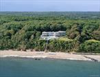 Secluded on over 8 acres of elevated land within the prestigious enclave of Belle Terre, this sprawling waterfront estate offers unmatched privacy and commanding views across the Long Island Sound. With approximately 300 feet of shoreline and panoramic 180-degree vistas, the property embodies the pinnacle of North Shore luxury living.The grand main residence, spanning nearly 20, 000 square feet, is designed for both intimate living and large-scale entertaining. Its thoughtful layout encompasses 11 bedrooms, 15 bathrooms, and multiple kitchens, seamlessly blending comfort with sophistication. A meandering drive through lush, mature landscaping culminates in an expansive driveway, creating a dramatic and elegant arrival.Beyond the main residence, the grounds feature a private guesthouse, a full-size tennis court, and recreational sport areas, all set within beautifully curated gardens. Private beach access and extensive outdoor living spaces complete this extraordinary retreat: where nature, seclusion, and timeless design converge in perfect harmony.