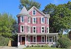 The Florence House  Contemporary Victorian EleganceStep into a piece of history with this extraordinary Victorian beauty, gracefully positioned in the heart of Beacon and offered for the first time since 1984. Built circa 1890, this remarkable three-story home has been lovingly owned by only three families throughout its storied existence, creating a rare opportunity to own a true gem. The Florence House is nothing but calm, elegant and timeless.Masterfully redesigned by Faust Design Build, this 2, 700 sqft residence represents the perfect marriage of historical grandeur and contemporary luxury. The thoughtful renovation honors the home&rsquo;s Victorian heritage while introducing modern conveniences that elevate everyday living. Offered completely turnkey and sold furnished, you can simply move in and begin enjoying upstate NY life immediately.As you enter the circular foyer, the stunning original oak paneling and staircase immediately takes you to a time gone by. The main floor showcases a stunning designer kitchen with beautiful white oak floors and MSI quartz countertops, complemented by an impeccable Portmore tile backsplash. The culinary centerpiece features brand-new stainless steel appliances, including a striking double-sided island perfect for preparation and casual dining. Thoughtful details like recessed lighting and custom cabinetry demonstrate meticulous attention to both form and function.The dining room serves as the perfect connector between kitchen, living room and family room creating seamless flow for entertaining. The dining room and adjacent living room captivate with their original parquetry white oak floors and wide windows that flood the space with natural light. A charming powder room featuring historical blue beadboard wainscoting adds upscale functionality.The second floor boasts beautiful original wood floors and houses the luxurious main bedroom with a large arched-top alcove that creates a light-filled sanctuary, and generous walk-in closet space. The main bathroom serves as a spa-like retreat with its wooden vanity topped with marble countertop housing two undermount sinks, a spacious walk-in shower with white herringbone ceramic tile walls, and white marble flooring. The piece de resistance is the stunning original white clawfoot bathtub that perfectly bridges historic charm with modern luxury. Another peaceful bedroom features sage green board and batten with toile wallpaper. The home&rsquo;s distinctive turret houses a bright office space, offering the perfect retreat for work or contemplation.The third floor expands versatility with two generous but cozy bedrooms and full bathroom featuring vintage vanity set against striking geometric floor tiles. The third-floor turret creates an ideal children&rsquo;s playroom or nursery.Set on an expansive 7, 405 sqft lot, the property boasts mature landscaping including original brick patio and bluestone pathways, complemented by stone benches and stunning trees like Japanese cherry and redbud alongside abundant perennials. The wraparound porch, complete with enclosed sunroom, provides a perfect setting for leisure. A private deck accessible from the kitchen offers ideal entertaining space with stairs leading to the backyard&rsquo;s secret garden, while the detached original carriage house could serve as studio space.Comprehensive renovation includes all new plumbing, HVAC, and electrical systems, plus premium Delta fixtures, new Andersen windows, and roof, ensuring worry-free ownership. Second-floor laundry adds practical luxury.Located minutes from Beacon&rsquo;s Main Street and Dia: Beacon museum, one block from country club/golf course with Metro-North access three minutes away and Manhattan 90 minutes south. The Florence House represents more than a homeâ€”it&rsquo;s your gateway to the dreamy Hudson Valley lifestyle, complete with every furnishing already in place.