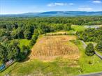 Unlock the potential of this stunning 3.4-acre parcel in the heart of Gardiner, ideally situated on well-traveled Route 208. Zoned Hamlet Commercial, this property opens the door to a wide variety of possibilities â€” With a variety of options given the HC zoning and a highly visible location, this land is ready to bring your vision to life. The land is gently rolling and mostly cleared, offering excellent road frontage and easy access. What really sets it apart are the breathtaking panoramic views of the Shawangunk Ridge, which provide a captivating backdrop for any future development. Whether admired by future customers, guests, or tenants, these views are impossible to ignore. This lot sits just minutes from Gardiner&rsquo;s charming hamlet center and the bustling outdoor scene of New Paltz, Mohonk Preserve, and Minnewaska State Park. Surrounded by scenic byways, hiking trails, farms, and wineries, it&rsquo;s a destination area with constant traffic and growth potential. Infrastructure is nearby, and the lot layout allows for a variety of configurations to suit your needs. The topography supports development while maintaining privacy and aesthetic appeal. If you&rsquo;re looking to build something truly special in one of Ulster County&rsquo;s most vibrant and visible corridors, this is the place. A location like this â€” with commercial zoning, natural beauty, and easy access â€” is a rare opportunity. Bring your ideas and see how far they can go on Sunrise Drive.