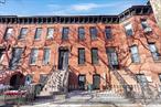 Welcome to this stunning fully renovated two-family brownstone located in the highly sought-after Bedford-Stuyvesant neighborhood in Brooklyn.   This townhouse boasts a luxurious owner&rsquo;s duplex, a finished basement, and ductless air-conditioning in each room, providing you with all the comforts of modern living. As you step inside the garden level, you&rsquo;ll be impressed by the elegant living room that flows seamlessly into the dining area and a chef&rsquo;s kitchen. The quartz kitchen island top, beautiful panel cabinets, and stainless-steel appliances make cooking and entertaining a pleasure. You&rsquo;ll also find a powder room and sliding doors that lead to a beautifully paved backyard, perfect for outdoor dining or relaxing.   On the parlor level, the master bedroom with an ensuite bath can easily accommodate a king size bed and has a custom-built walk-in closet. There are two additional bedrooms and a full bath, with one of them featuring exposed brick walls, which add character to the space. The third floor offers two more bedrooms, a full bathroom, and a quartz kitchen island top with elegant cabinetry, giving you another space to cook or entertain guests.   This is a turnkey unit to generate extra income and help you build equity. The private rooftop deck is the perfect place to host a party, soak up some sun, or get some fresh air. You can also enjoy working out or practicing yoga with an unobstructed view of the surrounding neighborhood and the sky. Transportation is a breeze, with the A, C, and J train lines or the B26 and B46 bus lines just a couple of stops away from Manhattan. The East New York LIRR stop is also just a few minutes away, making commuting a breeze. Don&rsquo;t miss out on the opportunity to own this exquisite townhouse in one of Brooklyn&rsquo;s most desirable neighborhoods.