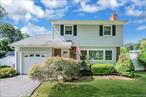 Pride of Ownership is Evident in this Charming 3-Bedroom Colonial, Ideally Situated on a Quiet Cul-de-Sac. Enjoy a sun-drenched living room featuring a wood-burning fireplace, perfect for cozy gatherings. The spacious primary bedroom features an oversized closet and a private entrance to the full bathroom. Both secondary bedrooms are generously sized. Beautiful hardwood floors flow throughout the home. The inviting sunken den offers direct access to the fully fenced backyard, ideal for indoor-outdoor living.  A full, unfinished basement provides abundant storage and potential for future customization.