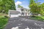 Set in a beautiful neighborhood of mature trees and well kept homes, this four-bedroom, three bath Colonial combines classic charm with modern comfort. Newer finished hardwood floors extend throughout the spacious interior. The large eat-in kitchen is perfect for gatherings and opens to a generous living room with a welcoming fireplace and formal dining room. Enjoy the convenience of a main floor laundry and a bright sunroom with high ceilings and skylights. Ideal for relaxing or entertaining. Upstairs, the private primary suite features a walk-in closet, dressing area, and full bath. Three additional bedrooms and another full bath complete the second floor, offering plenty of space for family or guests.A spacious patio provides the perfect spot for outdoor dining or quiet evenings, overlooking the peaceful backyard. This inviting home is ready for its next chapter in one of the areaâ€™s most desirable school districts. Check out the virtual tour!