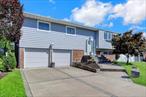 Great size Hi-Ranch with 2 car garage. Newer large ktichen with door to deck and spacious yard. Roof 4 years old. Lower level has bedroom or office, laund., large family room with brand new carpet and sliders to yard., and entrance to garage.  CAC  Convenient to all