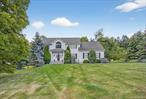 Welcome to 14 Meadow Crest Drive in the Mahopac school district, a stunning 4-bedroom Colonial that blends elegance, comfort, and lifestyle amenities just minutes from the Taconic Parkway. Step into the impressive two-story entryway highlighted by a retractable chandelier and continue into the spacious family room with cathedral ceilings, perfect for gatherings. Hardwood floors run throughout the home, adding warmth and character, while a versatile first floor flex space offers the ideal setting for a home office or playroom. The heart of the home is the large, sun-filled kitchen featuring a center island, perfect for cooking, entertaining, and everyday living. A convenient laundry room/mudroom are located right off the garage, keeping the household organized and functional. The main bedroom suite features two closets, including a walk-in, along with a private bath, while three additional generously sized bedrooms provide plenty of space for family or guests. Bedrooms are equipped with California Closet organizers. Outside, enjoy resort-style living with a gunite free-form pool with slide and jacuzzi, expanded patio area and a basketball court that can double as a pickleball court with a little TLC. Cul-de-sac living with a prime location close to local shops, dining, schools, and the Taconic Parkway, this gem is ready to welcome its next owner.