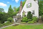 A MUST SEE - charming storybook Village Tudor in prime location with close proximity to train, school, park, and town. Morning coffee on the front terrace is just the start of what this 3-bedroom/2-bath home with private backyard offers. A beautiful living room with fireplace and vaulted ceiling is drenched in natural light. A cozy private den with sliding doors and built-ins is the perfect additional space for movie or game nights. The kitchen and dining area are open and spacious with an incredible office/homework center, and full bath. Two doors out to beautiful back patio and yard with firepit and garden make entertaining a breeze. Upstairs is a primary bedroom with double closets, a full bath, and two additional family bedrooms. An incredible bonus space rounds out this level complete with storage, and a lofted area. Central air, an attached garage, radiant heat in the updated kitchen are just a few of this home&rsquo;s incredible amenities. And last but not least this Larchmont Village home with is mere MINUTES to the train station, stores, restaurants, Turtle Park, and Starbucks just to name a few.