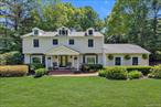 Dix Hills, Spectacular, Updated and Expanded Center Hall Colonial in Half Hollow Hills SD #5! This elegant yet inviting home offers a blend of modern updates and charming luxury including custom woodwork and moldings. The fantastic attention to details both inside and outside including a lush, outdoor, landscaped oasis is impressive! Featuring 4 bedrooms and 3.5 beautifully updated bathrooms, this home provides a bright, open floor plan with wall of windows over-looking the scenic backyard. The 1st floor of the home boasts dramatic Entry Foyer, Fabulous Formal Living Room and Formal Dining Room. The Living Room features double, French doors leading to the expanded Family/Great Room. The updated Gourmet Eat-in Kitchen features custom cabinetry, Granite counter tops, large center island, Top of the line Stainless steel appliances and a large eating area flowing into the Family/Great Room area. A Stunning fireplace is the center piece of the Family/Great Room/Kitchen area. Off the Kitchen is the convenient Laundry Area, Pantry Closets, Powder Room and access to the 2 car garage with lots of storage.  The 2nd floor features a dramatic Primary Bedroom Suite with Large walk-in closet, updated primary bath En Suite and slider out to balcony over-looking the stunning backyard. There are 3 additional spacious Bedrooms and fabulously Updated Full Hall Bathroom. The hardwood floors thru-out the first and 2nd floors exude warmth and sophistication. The Full Basement features, play areas, Office, Gym, lots of storage, plus much more! The magnificent property is exceptional and features a lush, 1-acre lot. This quiet and peaceful outdoor space was carefully laid out by a landscape architect and provides a tranquil setting with professional landscaping thru-out the property. The breath-taking back yard is a fantasy, conceived for relaxation and outdoor activities amidst the beauty of nature. It features a custom, free form pool perfectly placed with every landscaping feature conceivable to highlight its beauty, including a calming waterfall and specimen plantings! The massive paver patio and decking create many entertaining & sitting areas and the sprawling, serene grassy area has plenty of room for play! This property is an entertainer delight at every turn! Additional amenities and updates include NEW Central air conditioning, baseboard heating, 200 Amp electric, EV Hook up/220, Vinyl Siding, Windows, New Washer/Dryer, plus much, much more. Experience the perfect blend of elegance and comfort with updated features and scenic views that create a truly exceptional luxury way of life.