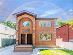 Elegant All-Brick Two-Family Home â€” Luxury Living & Smart InvestmentWelcome to this newly constructed, 100% brick two-family residence that seamlessly combines modern elegance, comfort, and investment potential.Nestled on a 4, 000 sq.ft. lot along a beautiful tree-lined block, this home features a wide private driveway and spacious backyard â€” perfect for family gatherings and outdoor entertaining.This turn-key, move-in-ready property is a rare opportunity for homeowners seeking both luxurious living space and an income-producing rental unit to help offset mortgage costs.Property Highlights:Two expansive 3-Bedroom / 2-Bath apartments with sun-filled open-concept layoutsRental income potential with separate utilitiesgranite countertops, stainless-steel appliances & center islandsKing-sized bedrooms with abundant closet spacePrimary suites with spa-style en-suite bathroomsDesigner bathrooms with floor-to-ceiling modern tileshardwood floors & central HVAC throughoutHigh-ceiling finished basement with interior/exterior access â€” perfect for a home office, gym, media room, or recreation areaConveniently located near Horace Harding Expressway, Long Island Expressway, Main Street, and College Point Blvd.Close to restaurants, cafÃ©s, schools, parks, and neighborhood conveniences â€” offering the best of Queens living in one perfect package.