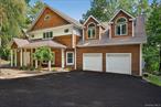 Located in the sought-after South Orangetown School District, this stunning 4-bedroom, 3.5-bath home sits on a quiet dead-end street in the picturesque Village of Piermont. Just 15 miles north of the George Washington Bridge, the home offers quick access to New York City and a range of convenient commuting options. Enjoy seasonal Hudson River views and direct access to the Raymond G. Esposito Memorial Trail for the outdoor enthusiast, which connects to over 8 miles of scenic, off-road paths via the Old Erie and Joseph B. Clarke Rail Trails. Inside, the home features hardwood flooring and a dramatic double-height ceiling in the family room, creating an airy ambiance filled with natural light. A wood-burning fireplace adds warmth and charm to the main living area, while the expansive deck offers seamless indoor/outdoor livingâ€”ideal for entertaining or unwinding in a peaceful setting. The primary bedroom ensuite offers a true retreat with custom-built walk-in closets and a spa-inspired bathroom. The lower finished level of roughly 730sf included in the total includes a full bathroom and summer kitchen, perfect for guests or multi-generational living. A walk-up attic provides excellent storage or potential for future expansion, and a two-car garage with electric car charger ensures added convenience. A standout feature of this home is the brand new, $80, 000 geothermal heating and cooling system, offering exceptional energy efficiency, consistent comfort, lower utility costs, and eco-friendly operation. Just a short walk into the heart of Piermont, you&rsquo;ll find upscale restaurants, vibrant nightlife, quaint coffee shops, and art galleriesâ€”all framed by the beauty of the Hudson River. With its prime location and blend of modern updates and historic charm, this home truly offers the best of Rivertown living in Rockland County.
