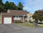 This well maintained split level home is located in the Hudson Valley, and in one of Kingston&rsquo;s most desirable neighborhoods, minutes away to shopping, schools, art galleries, historic districts, Hudson River and major highways. The spacious backyard oasis with it&rsquo;s covered stone patio, stone BBQ kitchen area, peaceful water feature and firepit is perfect for large gatherings or a retreat from busy days while enjoying your favorite drink. It is designed for seamless indoor-outdoor entertaining. And- you also have your very own apple tree waiting for you to pick and bake those delicious apple pies.  During the summer months, the newly installed central air conditioning perfectly cools the home for your relaxation. This home is complemented by 3 bedrooms, 1 full and one half bath(w/shower) plus a spacious lower level family room that has access to the large laundry room and one car garage. The kitchen was modernized with high end cabinets, counter tops and a custom made marble dining table to accommodate large family dinners. The living room is cozy and flows seamlessly into the dining area and kitchen which is a perfect design for entertaining. The original exterior siding was replaced with Hardie Board which is long lasting, and low maintenance for your peace of mind and continued beauty. Whether your first home, looking to relocate, or for a weekend retreat, this is perfect. So, what are you waiting for? Call today for an appointment
