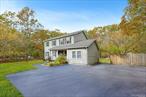 Tucked away in the peaceful Red Creek Ridge neighborhood, this classic colonial offers tranquility and privacy on 1.27 acres. With ample space for a pool and outdoor entertaining, the property is ideal for creating your own Hamptons retreat.The residence features 4 bedrooms and 2.5 baths, including a spacious ensuite primary. The eat-in kitchen flows seamlessly into the dining area, which opens through sliding glass doors to the patioâ€”perfect for dining al fresco or enjoying summer evenings. A versatile bonus room provides the perfect home office or creative space, while the large finished lower level offers additional living and recreational options.Lovingly maintained and move-in ready, this home combines charm, functionality, and tremendous potential. Conveniently located near beaches, marinas, and all the best of Hampton Bays, itâ€™s an opportunity to embrace the Hamptons lifestyle in a property designed for both relaxation and convenience.