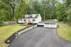 Tastefully updated and charming 3-bedroom Cape situated on almost an acre an a half on the border of Wallkill and Plattekill! This home features an open, sun-filled layout with luxury vinyl plank flooring throughout, large kitchen with white shaker cabinets, quartz countertops, a center island that fits 3 stools and SS appliances. Flowing into the dining area, which features a wood-burning stove and slider egress to the back deck with awning and level usable yardâ€”perfect for entertaining and plenty of room for a pool! The first floor includes the spacious primary bedroom, laundry, a full updated bathroom, and a cozy sitting room ideal for a home office. Upstairs, youâ€™ll find two additional well sized bedrooms. Additional features include a whole-house water filtration system and a brand-new well pressure tank. Full unfinished basement gives you plenty of storage with added corridor leading to the oversized 2-car garage. Exterior features new landscaping, blue stone pathways, Cambridge paver front walk, retaining walls and newly paved driveway allowing ample parking and turn around space. Private and move-in ready, this home blends comfort, space, and style both inside and out and has it all. Excellent location, minutes to I-87, Newburgh, Stewart International Airport, Village of New Paltz, local wineries, restaurants, shops, schools and more. Reach out and make this your home today!