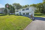 Welcome to 12 Sturr Lane in the heart of Florida, NY, a village within the town of Warwick. This spacious, bright, and airy raised ranch offers 4 bedrooms, 2 stylishly updated bathrooms, and a family room with a cozy brick wood-burning fireplace.One unique and special feature that is sure to mesmerize is the stunning, fully stocked Koi pond with a sparkling waterfall and dazzling night lights. The home offers the perfect layout with an updated, contemporary, yet warm style.The main level offers 3 bedrooms, a kitchen open to the dining area and living room, plus a renovated bathroom with a double vanity, bathtub, and state-of-the-art commode. The lower level features a large family room with a brick fireplace, an updated bathroom, one bedroom (presently utilized as a workshop) with new water-resistant vinyl flooring (see floorplan), a laundry room, a utility room, and access to the garage.The serene and chic interior has been painted in a neutral, cohesive palette, with new chandeliers and new contemporary interior doors. A new solar panel system was installed along with a battery backup that can provide power during power outages. The kitchen features gorgeous new tile flooring, a new LG refrigerator, light cabinetry, granite countertops, and LG appliances.The two-tiered decks offer plenty of space for entertaining, hobbies, and viewing the koi pond. The expansive yard features a vegetable garden and a new solar-powered shed.The location offers fiber optic internet available, municipal sewers, municipal waters and the Florida Union Free School District . Local amenities include downtown shops and restaurants, parks, farms, wineries, breweries, Legoland, Glenmere Lake and Greenwood Lake, golf, and hiking trails.