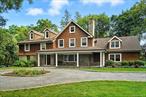 Discover the perfect getaway in this stunning shingle-style home, ideally set on 1.36 bucolic acres designed for both relaxation and entertaining. Enjoy resort-style amenities including a sparkling pool, private tennis court, outdoor fireplace with TV viewing area, multiple entertaining spaces, and lush designer landscaping offering unmatched privacy. Inside, the main level features living room: office and formal dining room, a chefs kitchen with island seating for five, top-of-the-line stainless steel appliances, a spacious pantry, and a separate bar area. A mudroom, two-car garage, and a versatile bedroom/office with a full modern bath complete the first floor. Upstairs, the primary suite offers a spa-like marble bath and walk-in closets with serene views of the property. Two additional bedrooms feature en-suite baths, while a fourth bedroom is served by a hall bath. A convenient second-floor laundry room completes this level. The finished lower level adds 1, 200 square feet of living space, including a home gym and comfortable lounge area. Offered fully furnished with exquisite decor, this property is move-in ready for your private retreat. Small dogs will be considered.